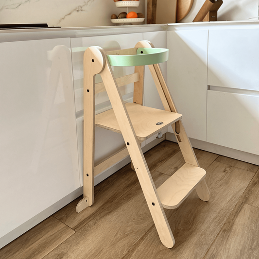 Foldable learning tower ideal as a stool to help young children help in the kitchen or bathroom