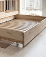 Detalle de cama nido inferior con somier de lamas